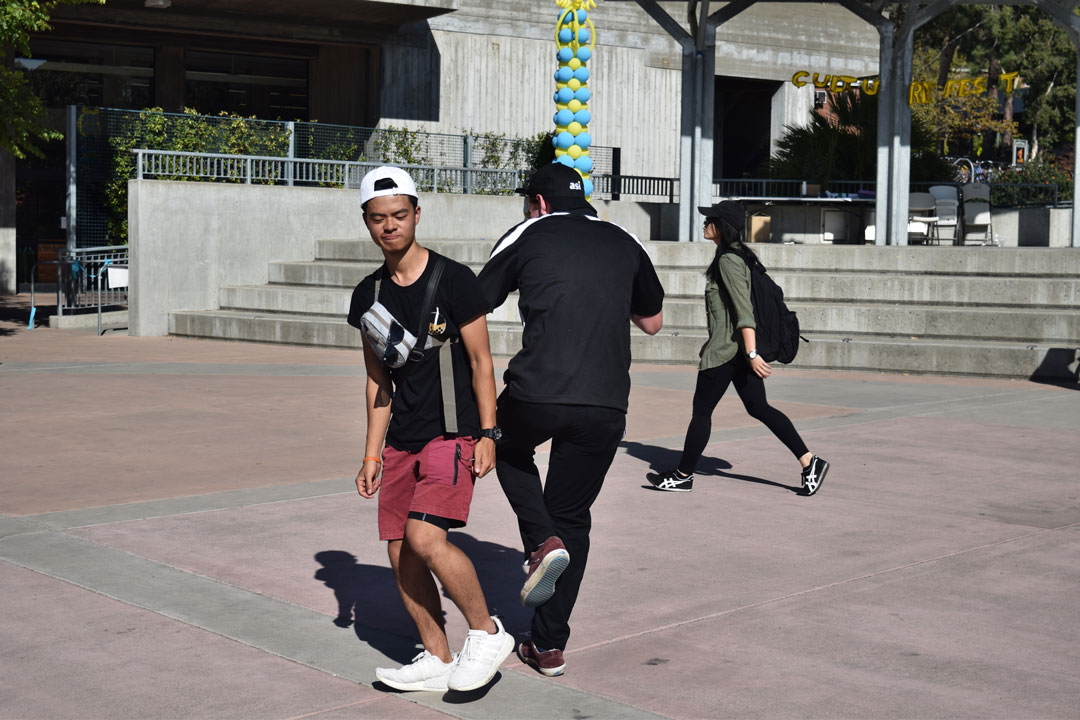 October 12, 2019 | UU Plaza | David Yang, a third year mechanical engineer, is seen dancing with an ASI member after the dance crowd disperses at the end of Culturefest. Yang, a participant who danced his own style, said the reason he dances is because “I can express myself and put the way I feel into movement.”